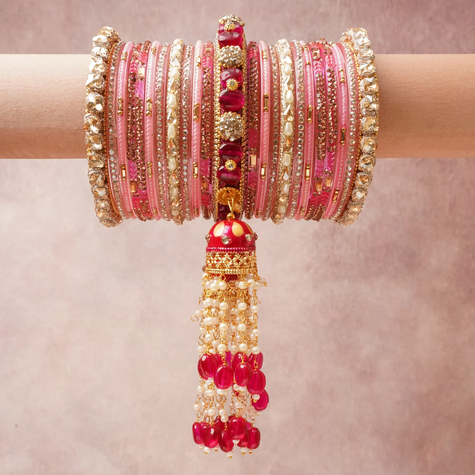 A commanding Fuchsia Pink anchors this beautiful set, enriched with accents of Gold, Ivory, Clear that add depth and dimension.

Featuring a striking composition of Glass, Metal Alloy, Faux Pearls, Cubic Zirconia, Enamel, Simulated Ruby, this set carries intricate craftsmanship and strong presence. Grand in form, it is created for moments that deserve to be marked.